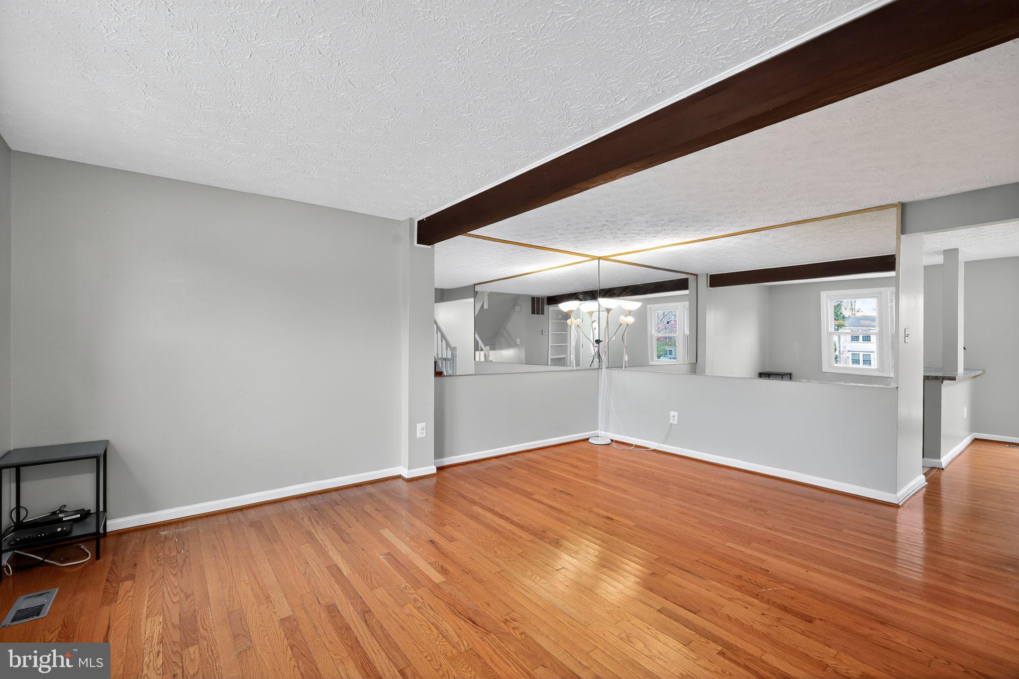 3602 Castle Terrace, Unit 116102 Silver Spring, MD 20904 - Photo 2 of 30 a view of empty room with wooden floor