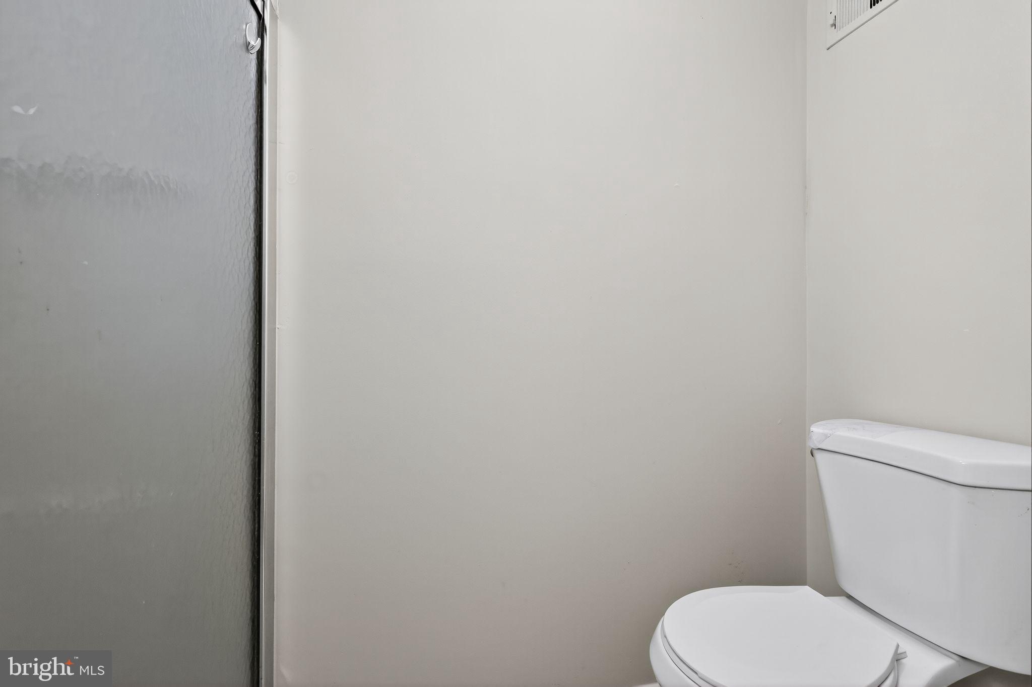 3602 Castle Terrace, Unit 116102 Silver Spring, MD 20904 - Photo 23 of 30 a white toilet sitting next to a white wall