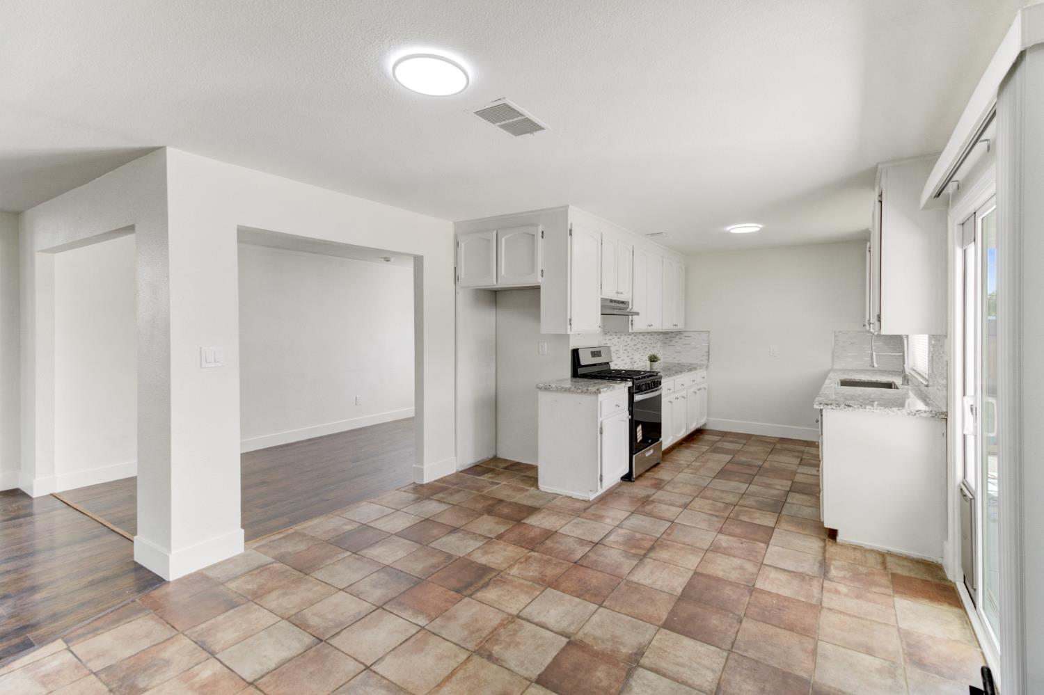 124 Fargo Way Folsom, CA 95630 - Photo 15 of 60 a kitchen with granite countertop a refrigerator and a sink