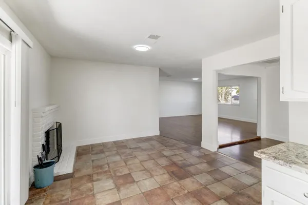 a view of an empty room and a window