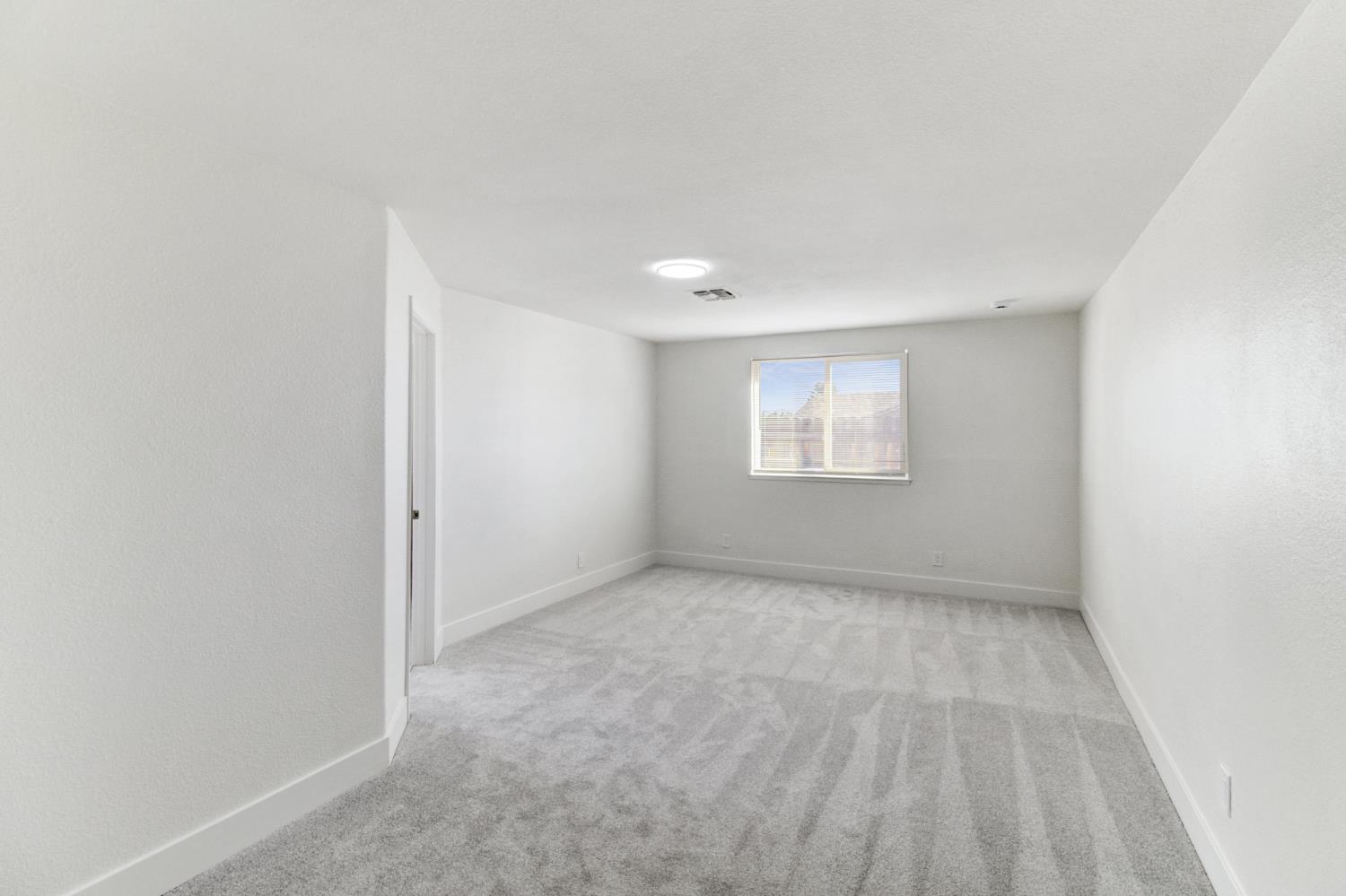 124 Fargo Way Folsom, CA 95630 - Photo 27 of 60 a view of an empty room and a window