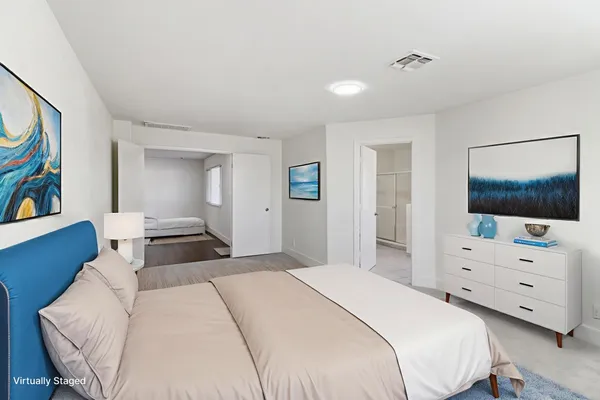 a bathroom with a glass shower door