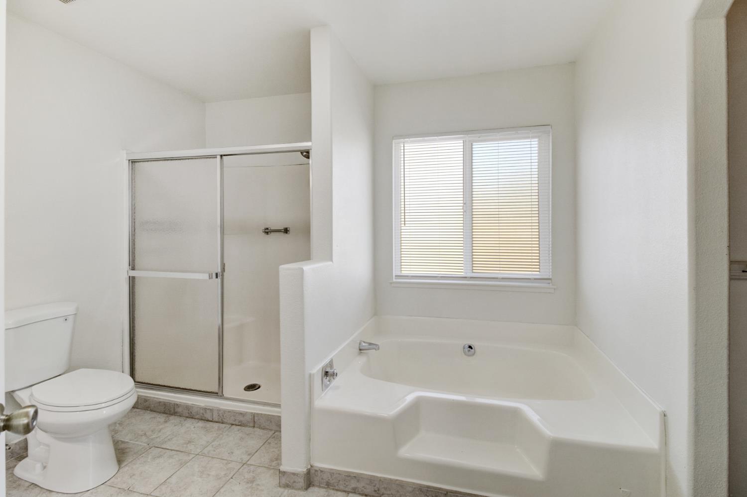 124 Fargo Way Folsom, CA 95630 - Photo 35 of 60 a bathroom with a toilet and a shower