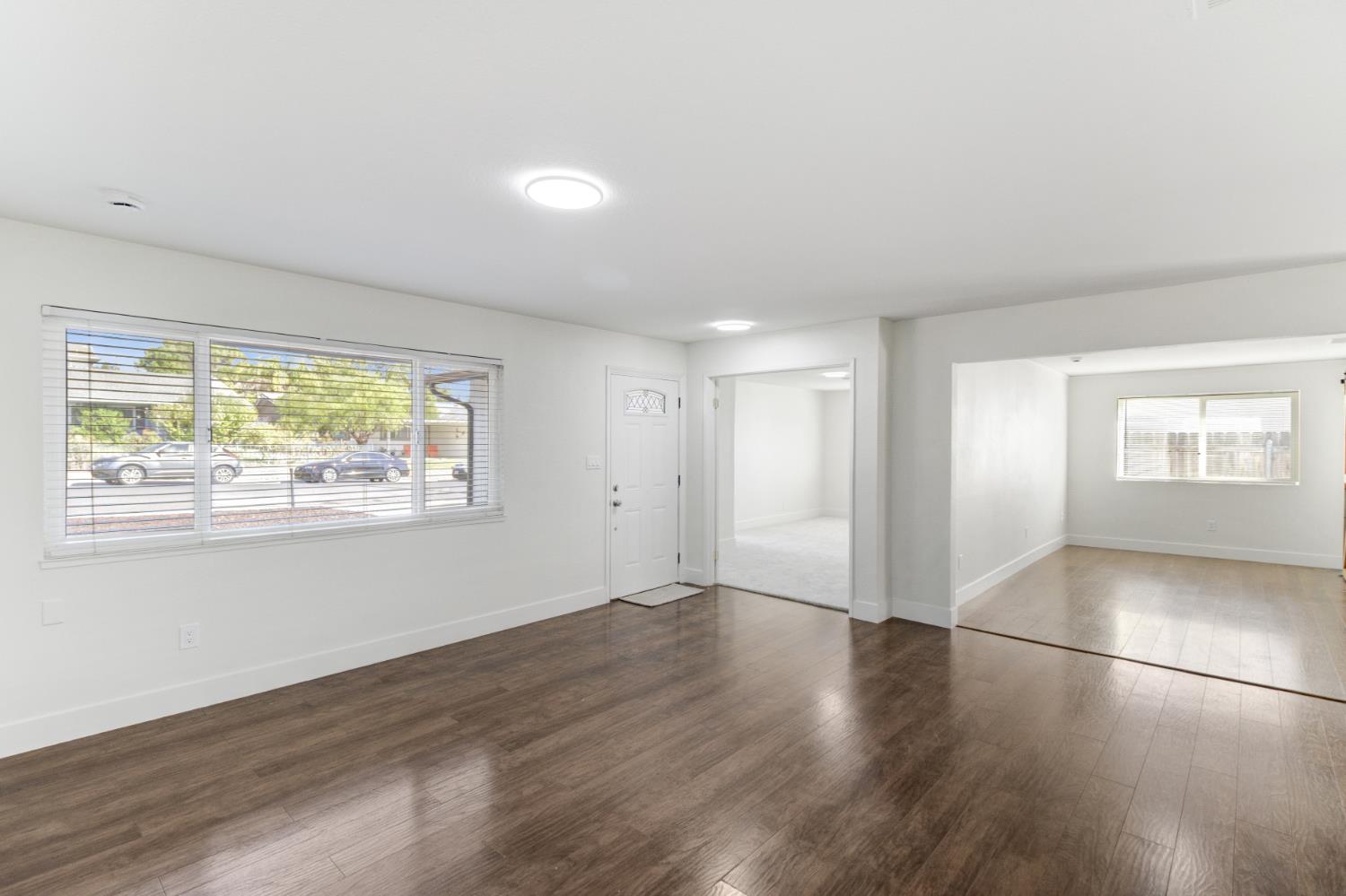 124 Fargo Way Folsom, CA 95630 - Photo 8 of 60 an empty room with wooden floor and windows