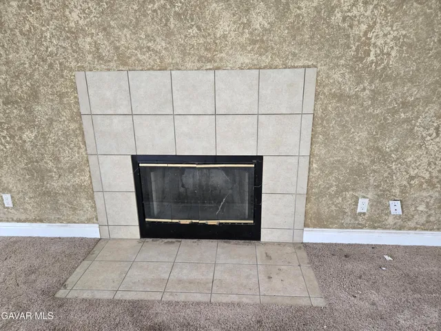 a fireplace with wooden floor