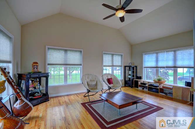 2 Banko Farm Road Dayton, NJ 08810 - Photo 14 of 24 a living room with furniture a window and gym equipment