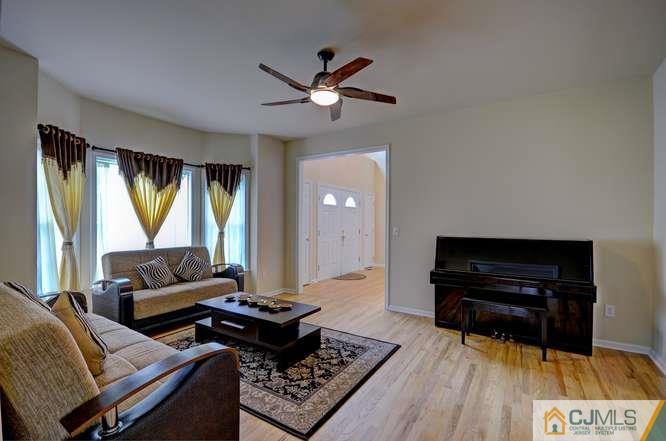 2 Banko Farm Road Dayton, NJ 08810 - Photo 3 of 24 a living room with furniture and a wooden floor