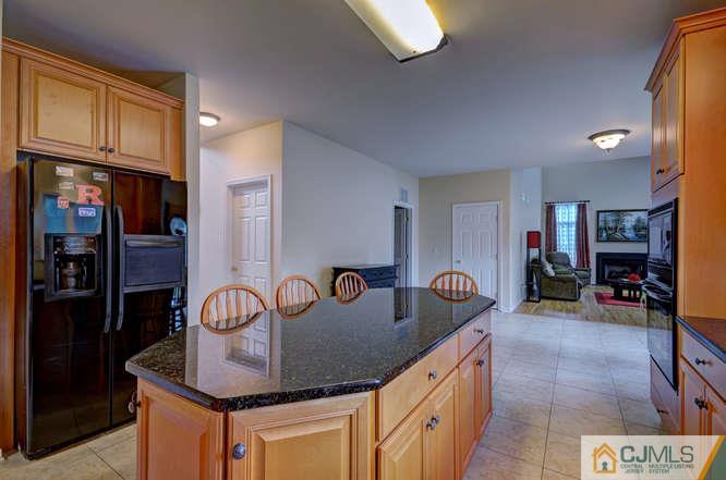 2 Banko Farm Road Dayton, NJ 08810 - Photo 10 of 24 a kitchen with stainless steel appliances granite countertop a sink and cabinets