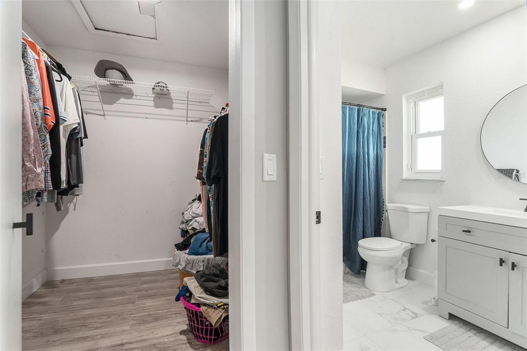 10234 Bedford Road Spring Hill, FL 34608 - Photo 22 of 31 a view of walk in closet with clothes and shoes