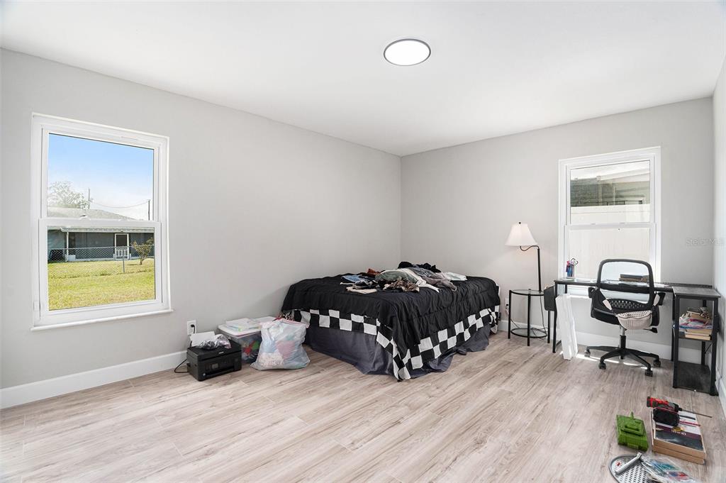 10234 Bedford Road Spring Hill, FL 34608 - Photo 23 of 31 a bedroom with a bed and a window