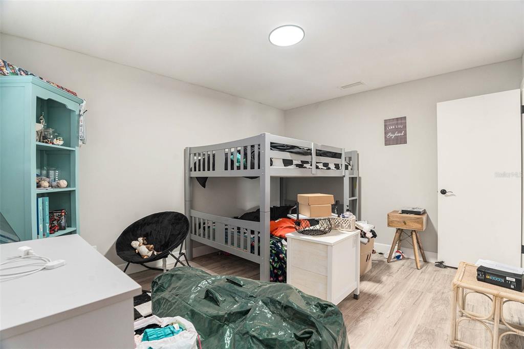 10234 Bedford Road Spring Hill, FL 34608 - Photo 27 of 31 a work room with furniture and a wooden floor