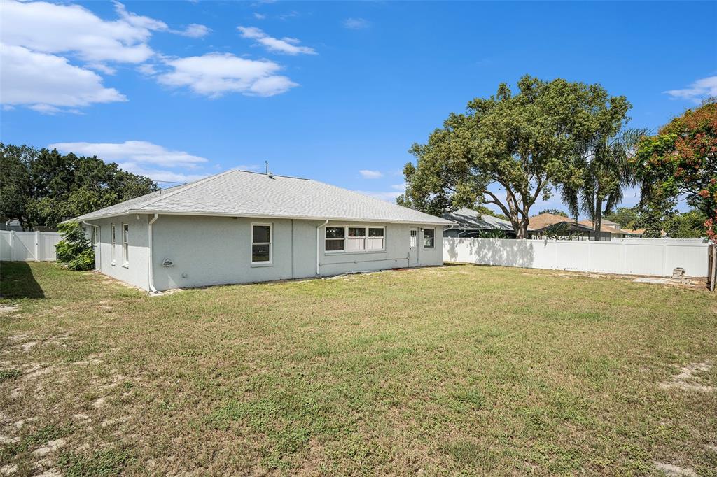 10234 Bedford Road Spring Hill, FL 34608 - Photo 31 of 31 a front view of a house with a yard