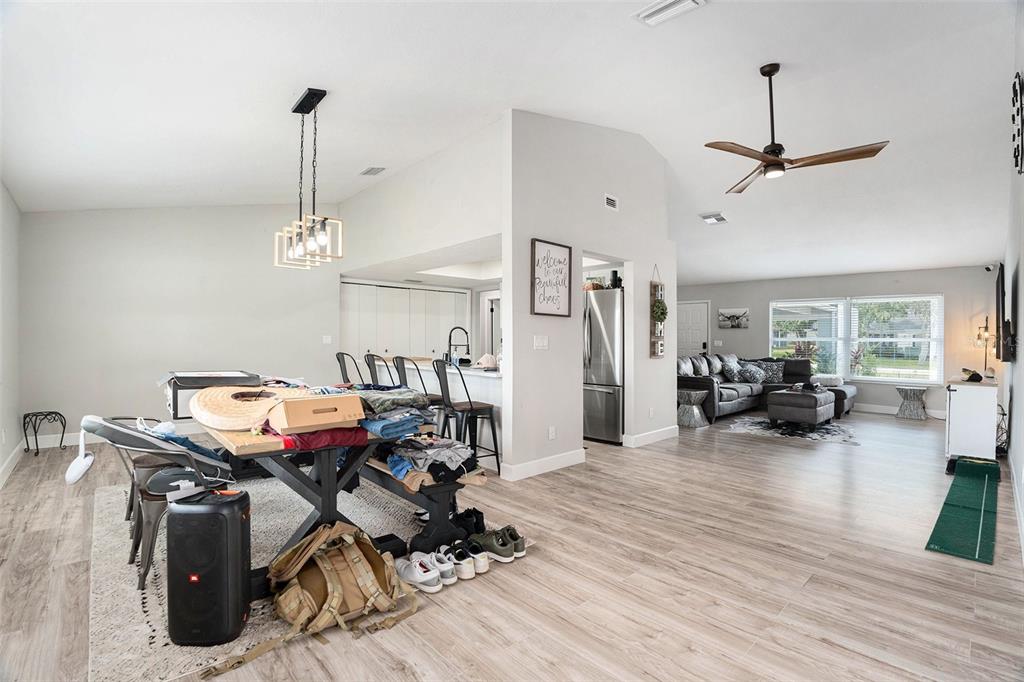 10234 Bedford Road Spring Hill, FL 34608 - Photo 10 of 31 a view of a livingroom with furniture and a chandelier