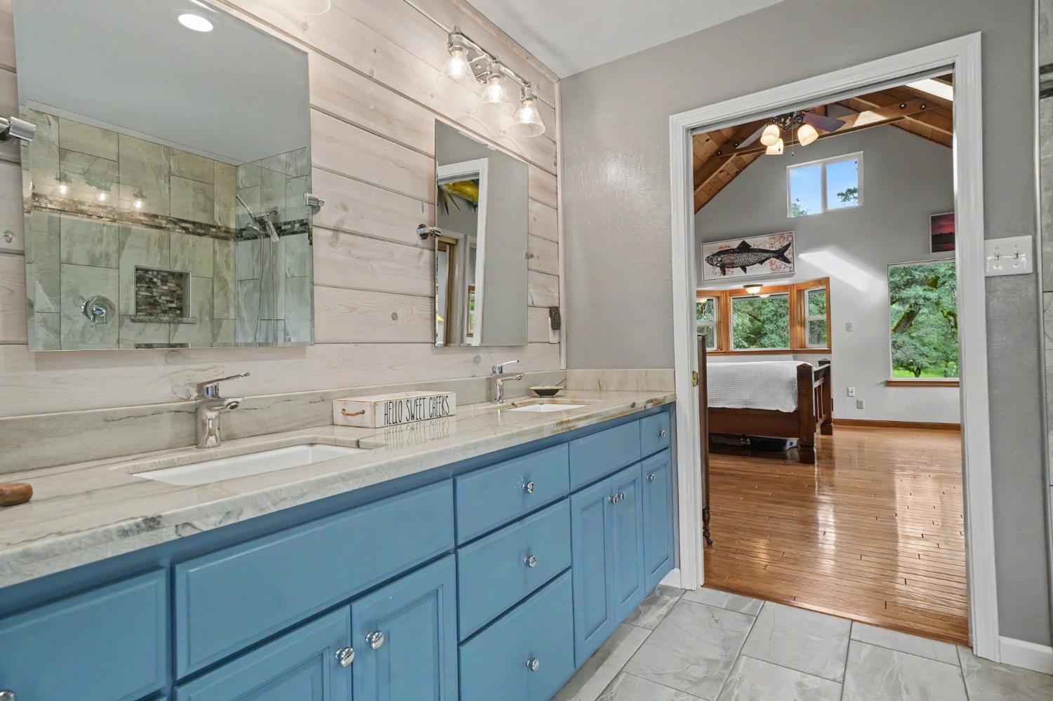 19351 Fiddletown Road Fiddletown, CA 95629 - Photo 30 of 51 a bathroom with a sink and a mirror
