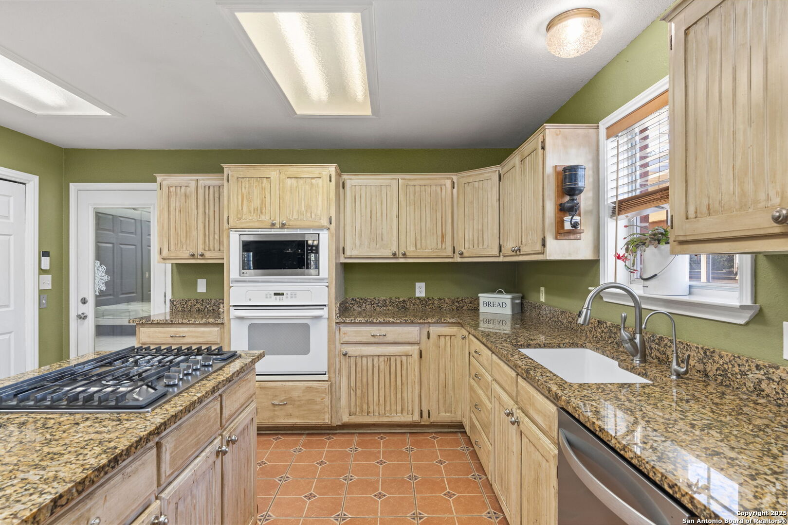 4335 Mail Rte Road Fischer, TX 78623 - Photo 18 of 50 a kitchen with a sink stove top oven and refrigerator