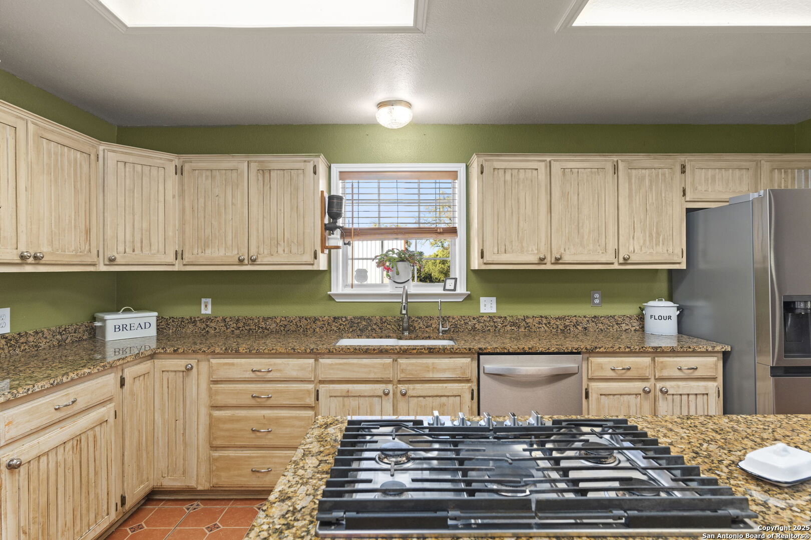 4335 Mail Rte Road Fischer, TX 78623 - Photo 19 of 50 a kitchen with stainless steel appliances granite countertop a stove a sink and a refrigerator