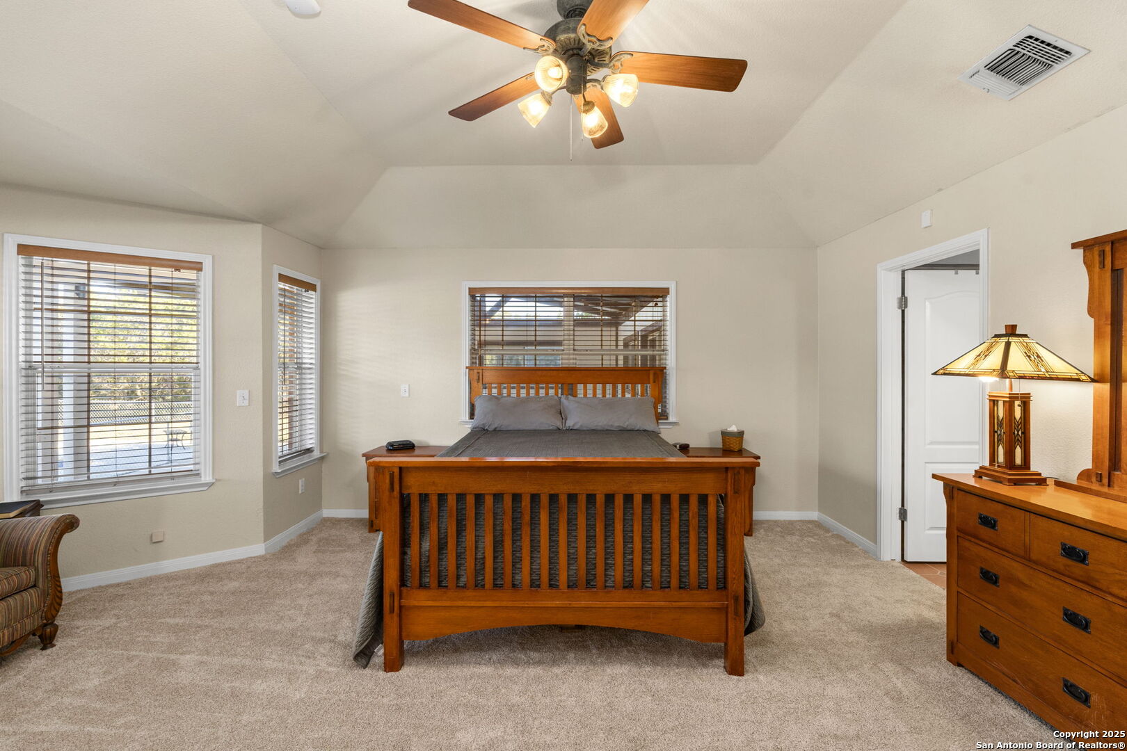 4335 Mail Rte Road Fischer, TX 78623 - Photo 21 of 50 a bedroom with a bed and a chandelier