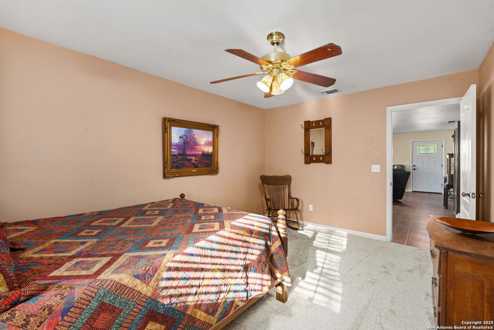 4335 Mail Rte Road Fischer, TX 78623 - Photo 26 of 50 a bedroom with a bed and a chandelier