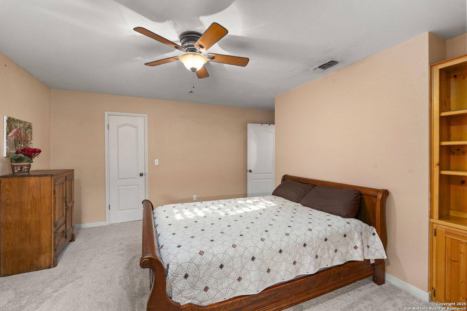 4335 Mail Rte Road Fischer, TX 78623 - Photo 27 of 50 a bedroom with a bed and a dresser