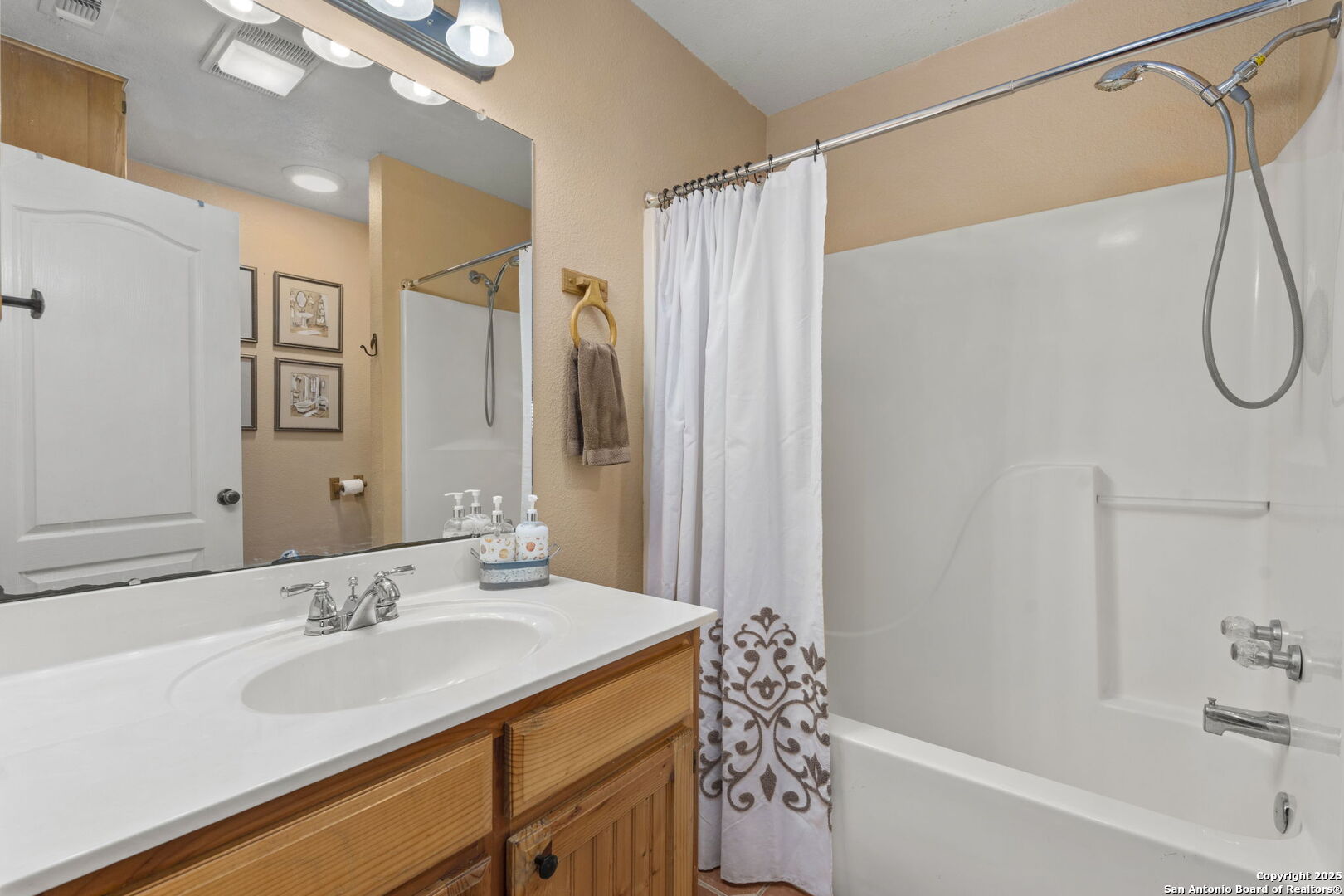 4335 Mail Rte Road Fischer, TX 78623 - Photo 29 of 50 a bathroom with a granite countertop sink a mirror a shower and a bathtub