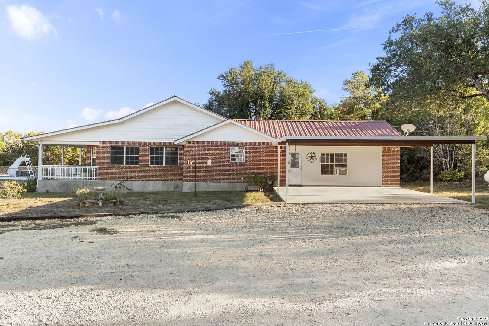 4335 Mail Rte Road Fischer, TX 78623 - Photo 32 of 50 a front view of a house with a garden
