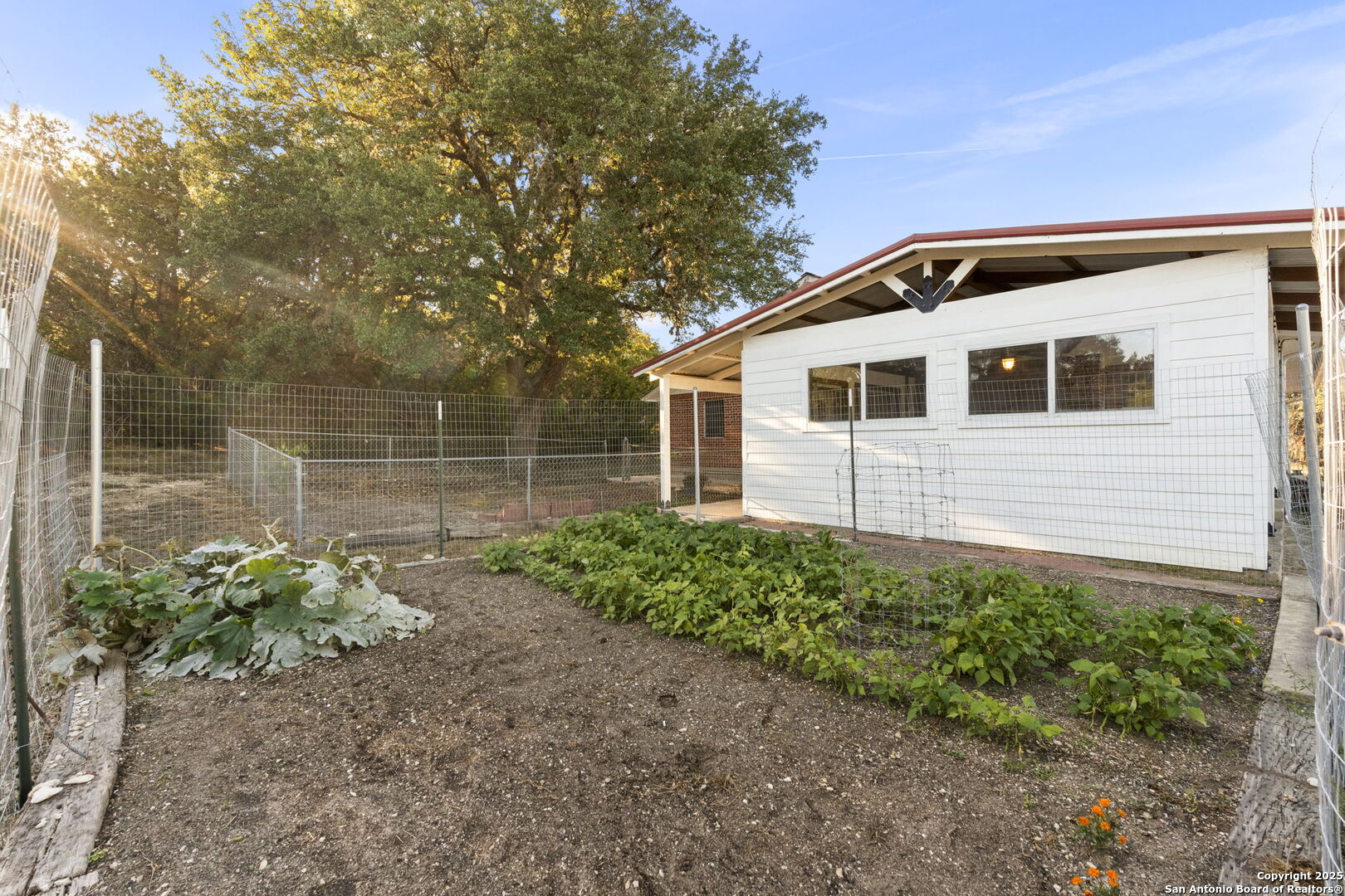 4335 Mail Rte Road Fischer, TX 78623 - Photo 42 of 50 a front view of a house with a garden