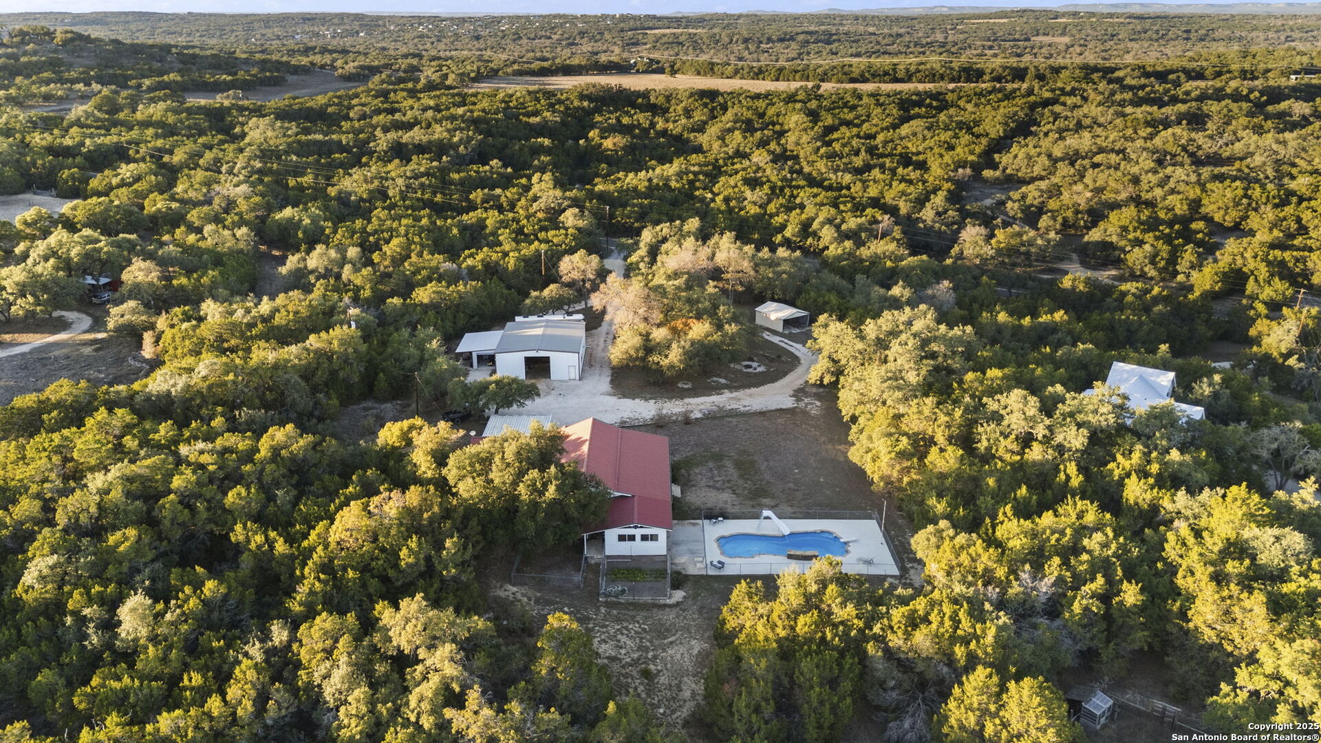 4335 Mail Rte Road Fischer, TX 78623 - Photo 49 of 50 an aerial view of residential house with outdoor space and trees all around
