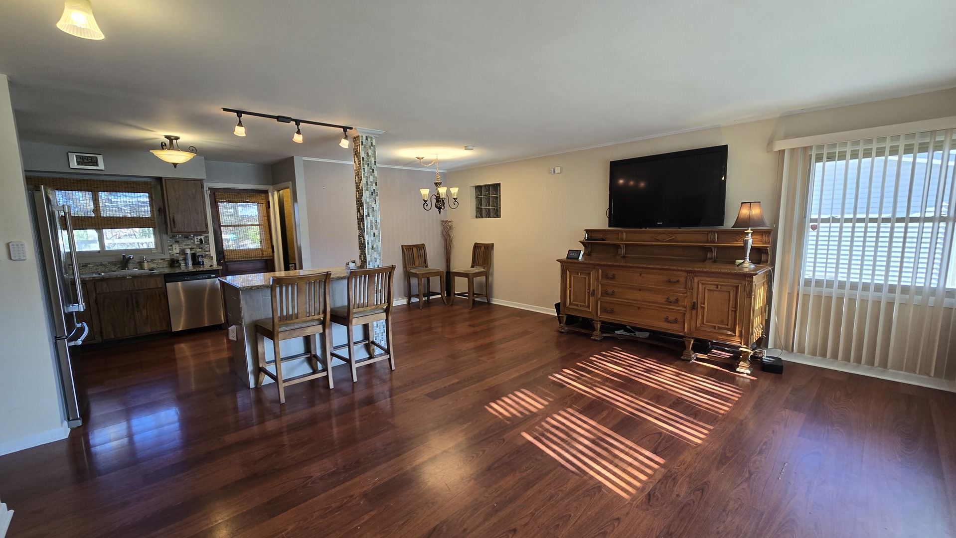 1025 Longaker Road Northbrook, IL 60062 - Photo 3 of 33 a living room with furniture flat screen tv and wooden floor