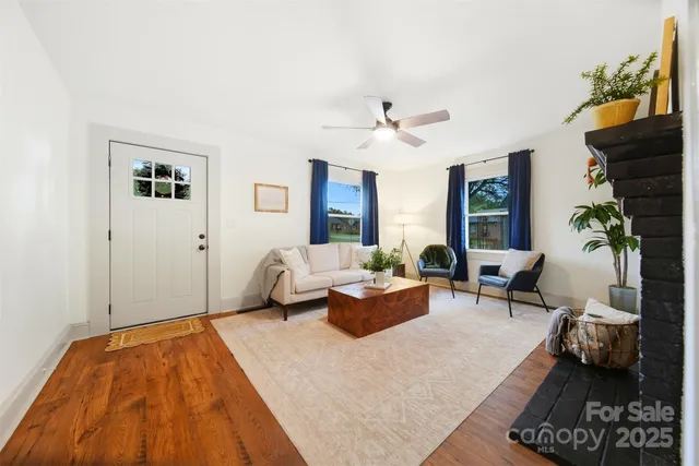 a living room with furniture rug and window