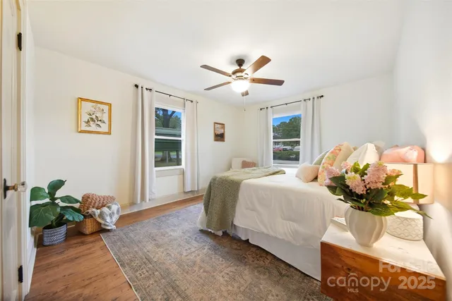 a bedroom with a bed and ceiling fan