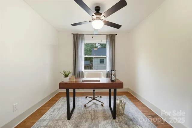 a workspace with furniture and a window