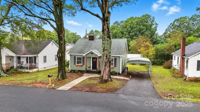 front view of a house with a yard patio and fire pit