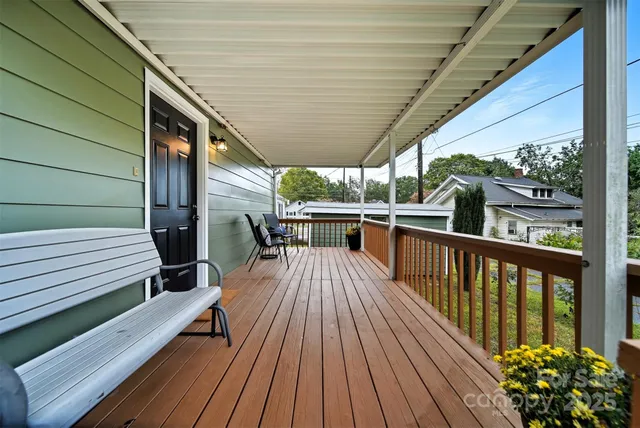 a view of outdoor space with wooden floor and outdoor seating