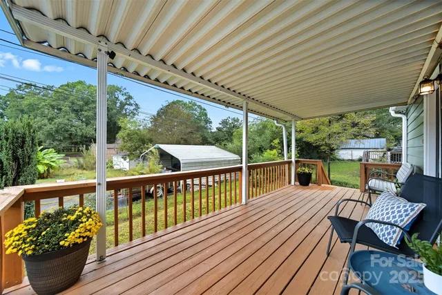 a view of a patio with a table chairs and a patio
