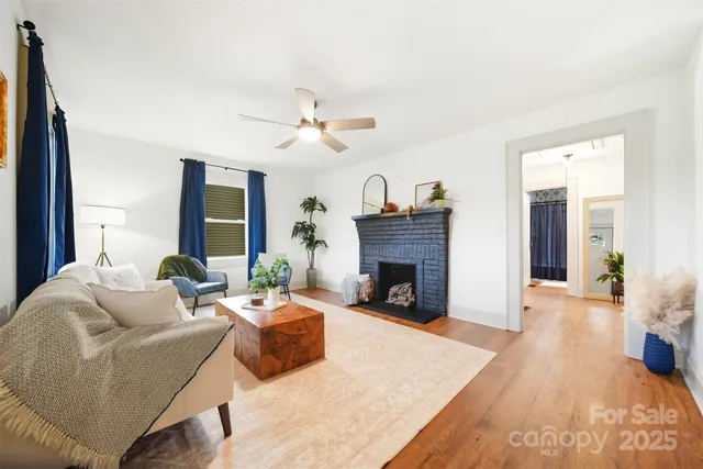 a living room with furniture and a fireplace