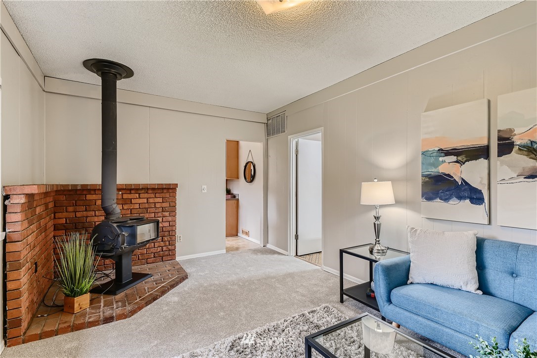 706 221st Street Southwest Bothell, WA 98021 - Photo 13 of 27 a living room with furniture a rug and a rug