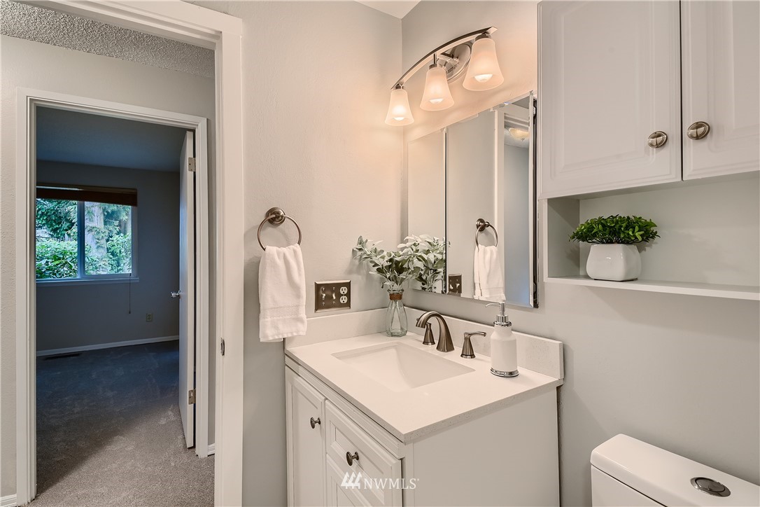 706 221st Street Southwest Bothell, WA 98021 - Photo 16 of 27 a bathroom with a sink and a mirror