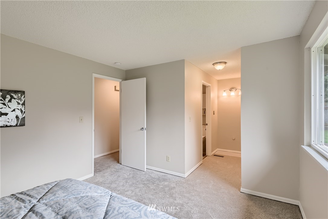 706 221st Street Southwest Bothell, WA 98021 - Photo 19 of 27 a view of a room with a hallway and closet area