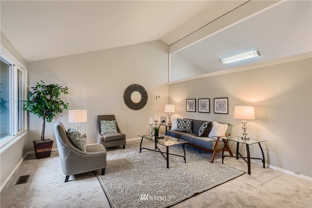 706 221st Street Southwest Bothell, WA 98021 - Photo 2 of 27 a living room with furniture and a potted plant