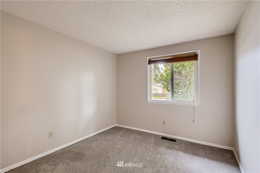 706 221st Street Southwest Bothell, WA 98021 - Photo 21 of 27 an empty room with a window