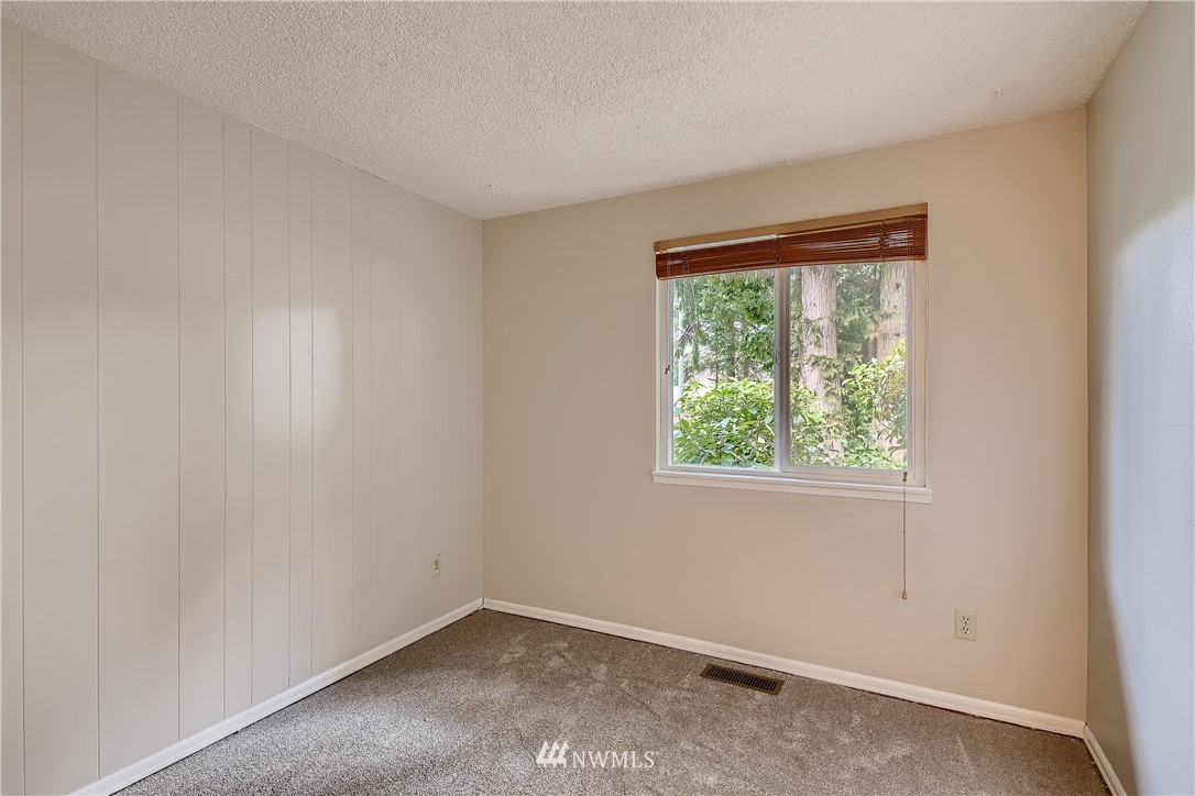 706 221st Street Southwest Bothell, WA 98021 - Photo 23 of 27 an empty room with a window