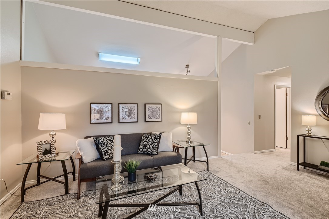 706 221st Street Southwest Bothell, WA 98021 - Photo 3 of 27 a living room with furniture and a fireplace