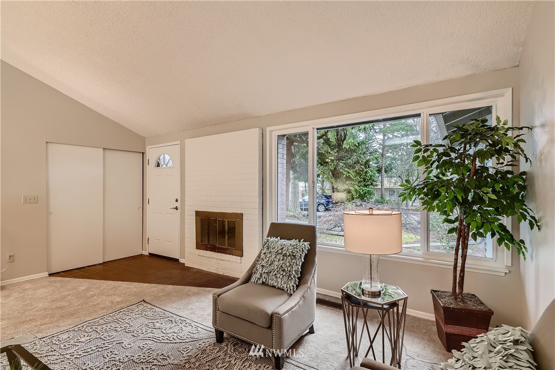 706 221st Street Southwest Bothell, WA 98021 - Photo 5 of 27 a living room with furniture and a fireplace