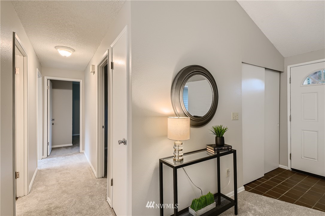 706 221st Street Southwest Bothell, WA 98021 - Photo 7 of 27 a view of a livingroom with furniture and a mirror