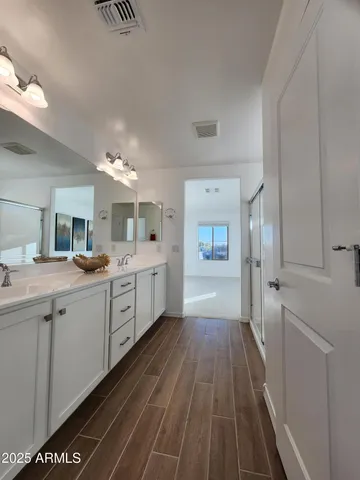 a view of a kitchen with a refrigerator and a sink