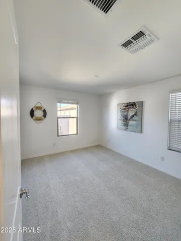 a bathroom with a double vanity sink toilet mirror and bathtub