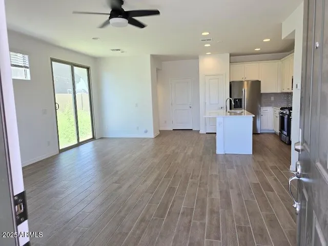 a view of kitchen with cabinets and wooden floor