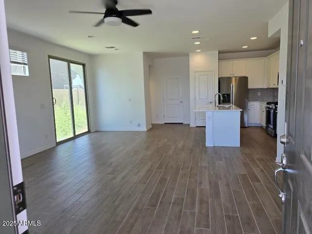 a view of kitchen with cabinets and wooden floor