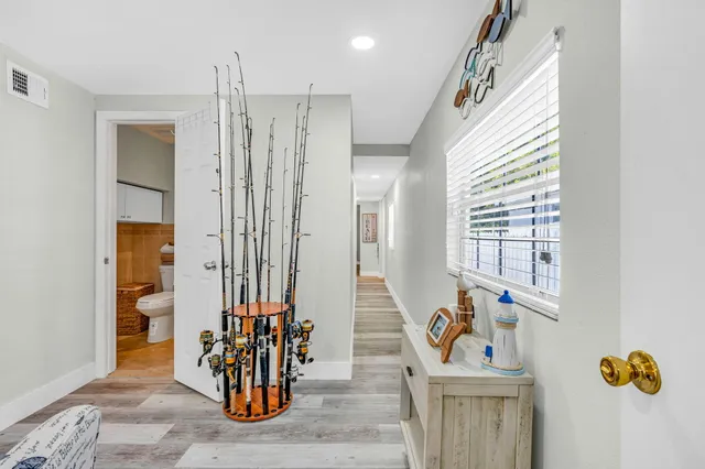 a view of an entryway with wooden floor