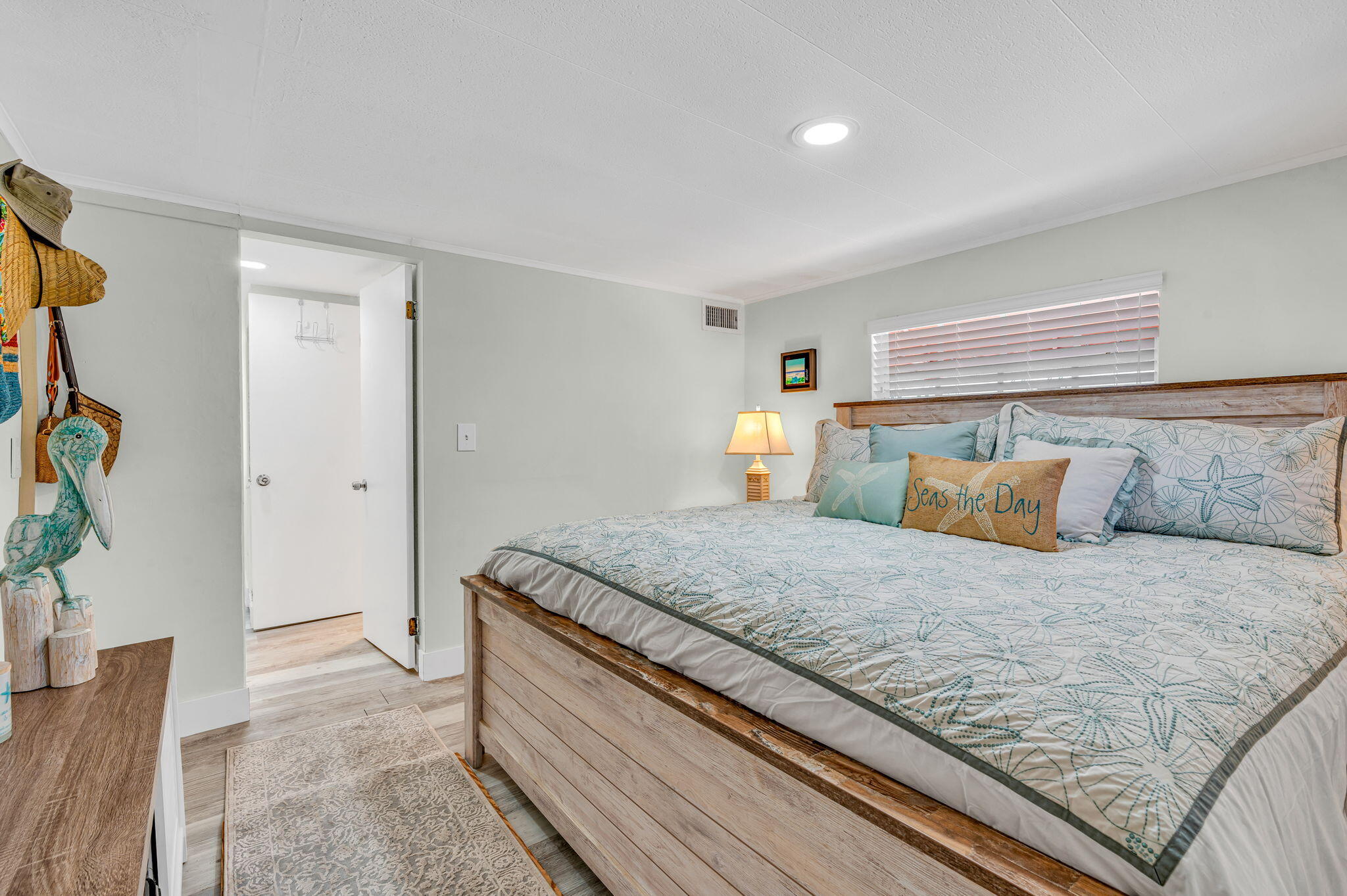 136 Sable Palm Lane Tavernier, FL 33070 - Photo 13 of 39 a bedroom with a large bed and a couch